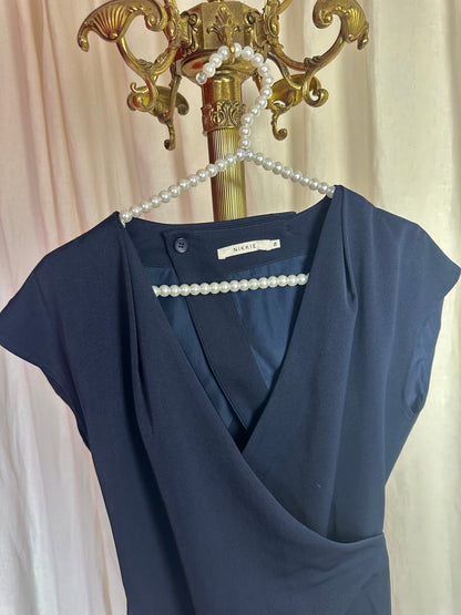 Jurk Nikkie open rug donkerblauw maat 36